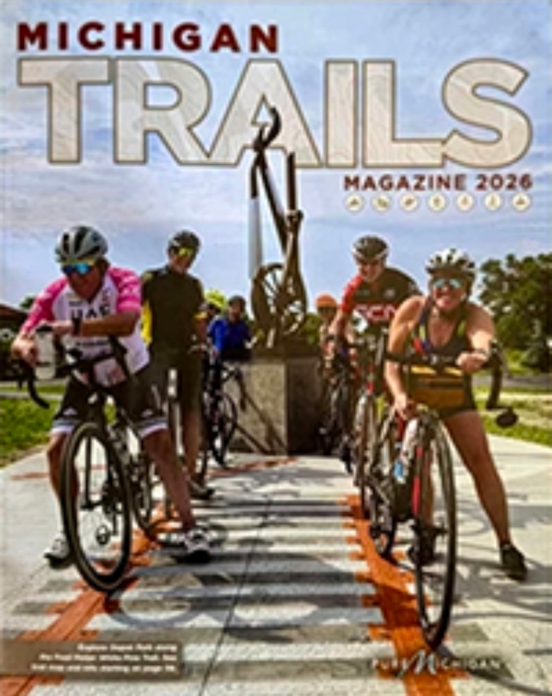 Product Description: This Canvas Bella Softsytle shirt in Dark Gray Heather is available in both Unisex and Female Cuts in sizes ranging from XS - 4XL.</br></br>The 2026edition of Michigan Trails Magazine features updated maps, photos, and trail information, including over 2,500 miles of Michigan’s best nonmotorized biking, hiking, and water trails. Escape to Michigan’s wild places. Explore old abandoned railways reinvented as paved pathways linking cities and small towns through shady forests and vast verdant farmland. Hike or bike a singletrack through unspoiled wilderness. Paddle secluded shorelines and peaceful rivers.</br></br>Price includes shipping.Get this deal while it lasts!</br> 2026 Michigan Trails Magazine + MMBA T-shirt