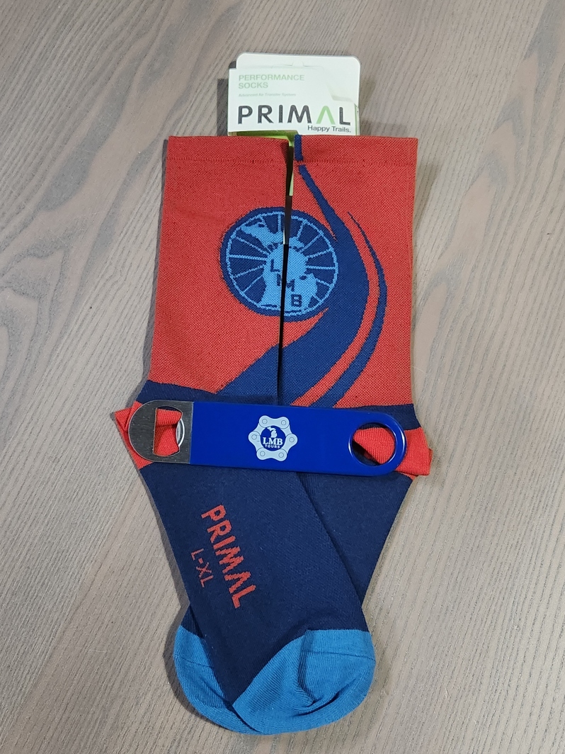 Product Description: LMB logo super comfy performance socks:</br></br>Advanced air transfer fabrics help ventilate and wick away excess moisture keeping your feet cool and dry. Seams and stitching are designed for a comfortable fit without any slippage inside your shoe</br></br>Mesh Top</br></br>Moisture Wicking</br></br>Tall Cuff, Mid Calf Height</br></br>Branded colors by Primal</br></br>LG/XL= U.S. Shoe Size 9-13 only</br></br>Enjoy a tasty beverage anywhere. This opener is rubber-coated to avoid scratching your cooler walls, but tough enough to bounce around during a ride or after.</br> LMB Primal Socks and Bottle Opener