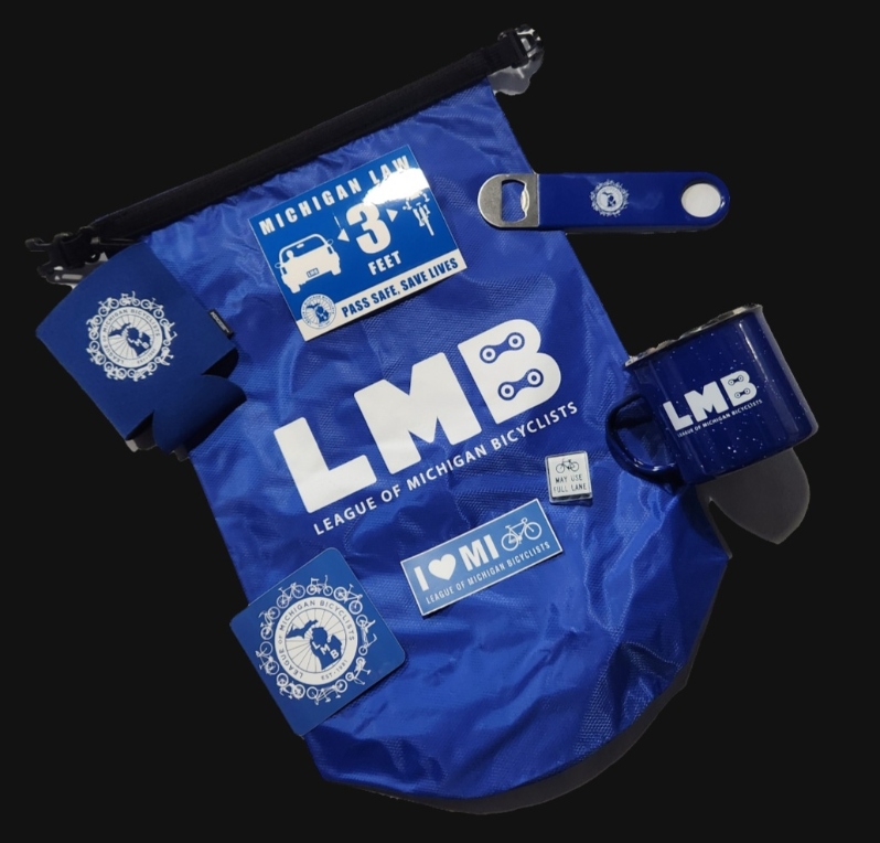 Product Description: Your ideal outdoor bag, mug and more!</br></br>This set includes: an LMB dry bag, MUP mug, tour bottle opener, koozie, variety of three stickers, and a pin!</br></br>The LMB Dry Bag is a great addition to your riding essentials. It is waterproof, lightweight, and easily snaps on to a bag or belt.</br></br>Polyester material</br></br>Roll top closure with a plastic buckle</br></br>The Blue Foundry 16 oz enamel-lined campfire coffee mug. Blue with white imprint: LMB Wordmark + MUP logo.</br></br>(The koozies are sold out.)</br> LMB Dry Bag, Mug and Goodies