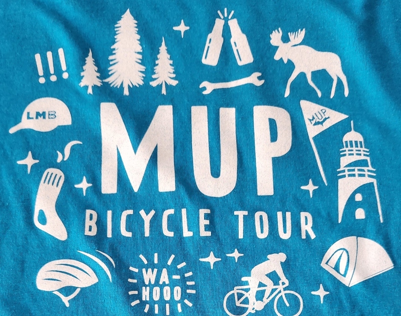 Product Description: This MUP t-shirt celebrates the UP! Even when you're not ridingour Upper Peninsula tour, you can show your love with on of these great cotton tees.</br> MUP 2022 Turquoise Cotton T-shirt