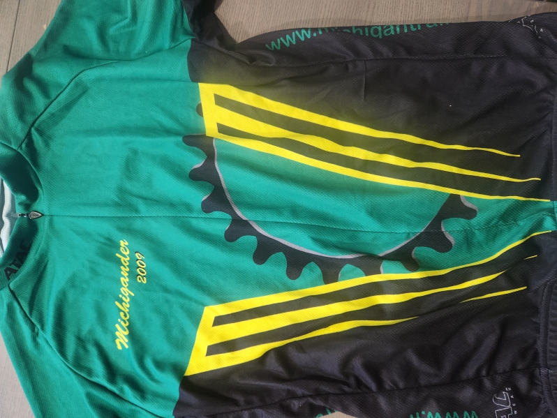 Product Description: All Michigander jerseys are crafted with elite fabrics and advanced fit technology to provide the most comfortable riding experience. Utilizingindustry-leading fabric, these jerseys are designed to wick moisture from the surface of the skin and push it to the face of the jersey where it quickly evaporates.</br></br>Please consult Primal'ssizing guide(standard fit) before placing your order.</br></br>Features:</br></br>Raglan style sleeves</br>Full length zip-up</br>Three rearcargo pockets</br>Elastic at sleeve cuff and waist</br> Michigander Jersey 2009 Men's