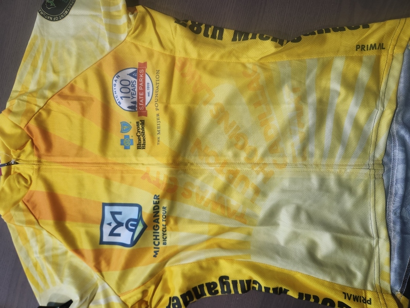 Product Description: All Michigander jerseys are crafted with elite fabrics and advanced fit technology to provide the most comfortable riding experience. Utilizingindustry-leading fabric, these jerseys are designed to wick moisture from the surface of the skin and push it to the face of the jersey where it quickly evaporates.</br></br>Please consult Primal'ssizing guide(standard fit) before placing your order.</br></br>Features:</br></br>Raglan style sleeves, sleeveless or tank</br>Full length zip-up</br>Three rearcargo pockets</br>Elastic at sleeve cuff and waist</br> Michigander Jersey 2019 Women's