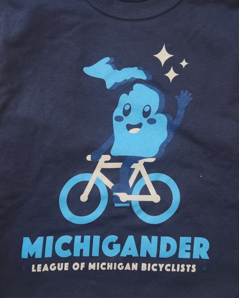 Product Description: Comfy cotton tee that illustrates the timeless spirit of the Michigander tours!</br> 2023 Michigander T-Shirt Blue