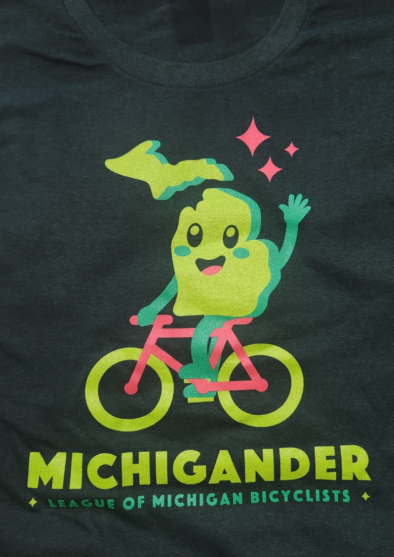 Product Description: Comfy cotton tee that illustrates the timeless spirit of the Michigander tours!</br> 2022 Michigander T-Shirt Green