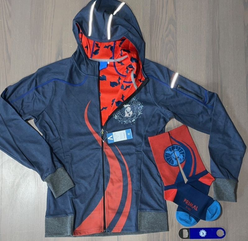 Product Description: Ideal outerwear set for anyseason on or off the bike</br></br>This form-fitting hoodieand comfy socks from Primal aregreat for cycling or everydaywear. Look good or treat someone else to these must-haves and then relax with a refreshing drink after using our handy dandy bottle opener.</br></br>Our custom design features the LMB logo on the front chest and back with a repeating Michigan pattern inside the hood.Click "More Images" above for a closer look.</br></br>Here’s how Primal describes it:</br></br>“A melange poly blended knit fabric with SpeedMesh backing. The 2-way mechanical stretch allows the fabric to move with the most experienced breakdancer. The Primal Hoodie is a classic wardrobe staple with a stylish twist and some serious performance features, like the stowaway bicep zip pocket. It’s perfect for temperatures ranging from 40-80 degrees F and a 2-way mechanical stretch that keeps the fabric flexible yet durable."</br></br>Tech Specs</br></br>Full Length Exposed YKK Zipper</br>Flatlock Stitching</br>Front Hand Pockets</br>Gravity Mélange Fabric</br>Reflective Accents</br>Stowaway Bicep Zip Pocket</br></br>All hoodies are adult sizes and unisex fit. Use the men's sizing chart here:https://www.primalwear.com/pages/fit-guide</br></br>LMB logo super comfy performance socks:</br></br>Advanced air transfer fabrics help ventilate and wick away excess moisture keeping your feet cool and dry. Seams and stitching are designed for a comfortable fit without any slippage inside your shoe</br></br>Mesh Top</br></br>Moisture Wicking</br></br>Tall Cuff, Mid Calf Height</br></br>Branded colors by Primal</br></br>LG/XL= U.S. Shoe Size 9-13 only</br> Hoodie, Socks and Opener Set